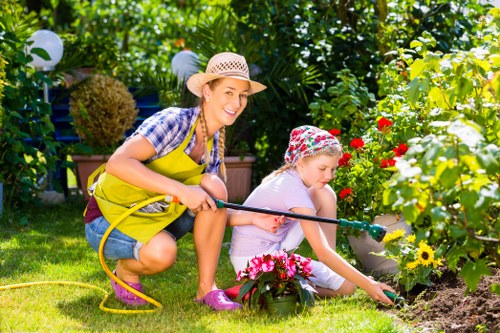 Volunteers and charity partners receiving reusable gardening tools and pots